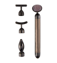 Set of black and bronze massage tools on a white background