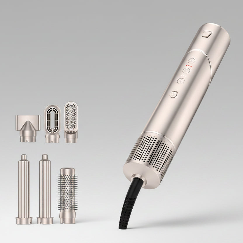 Folding hair comb with interchangeable nozzles on a gray background