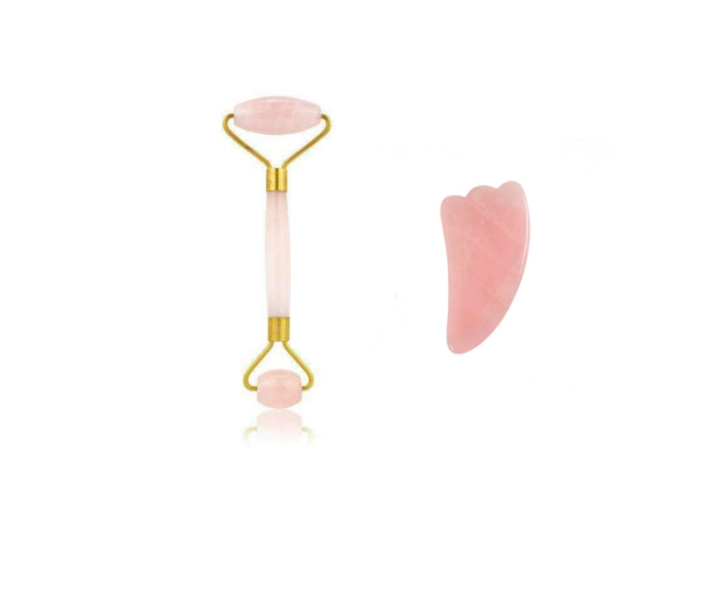 Two pink skincare tools on a white background