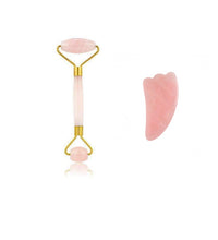 Two pink skincare tools on a white background