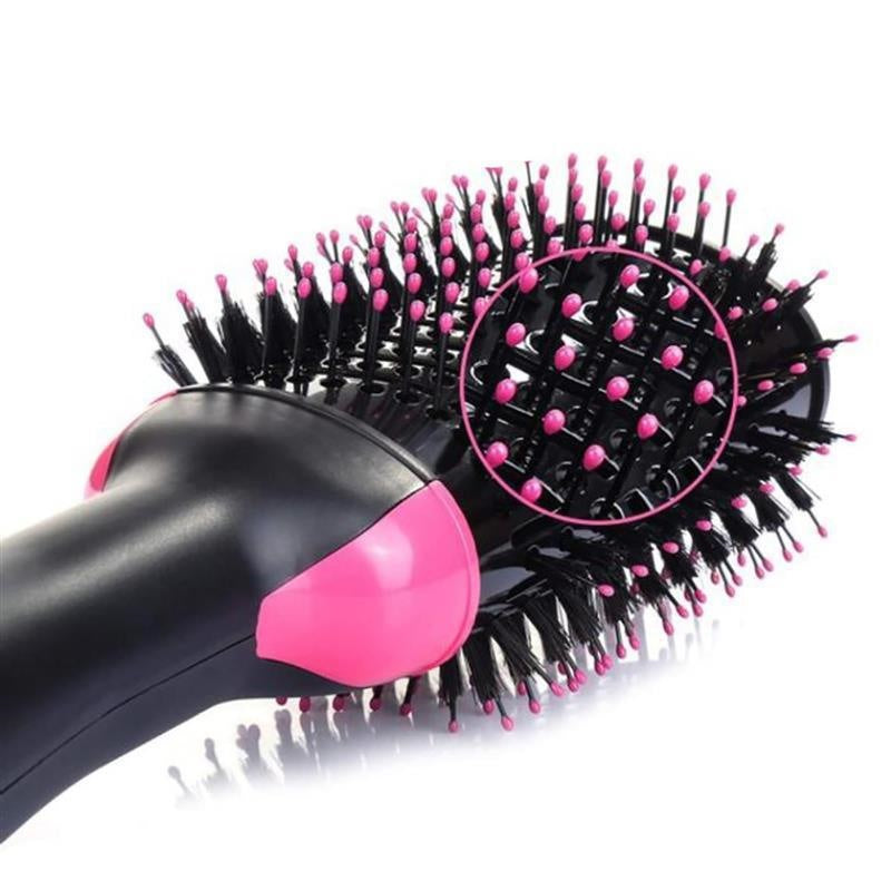 Hairbrush with black bristles and pink accents on a white background