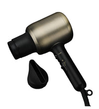 Black and gold hair dryer on a gray marble surface with a box in the background.