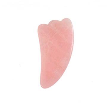 Pink stone with a unique shape on a white background