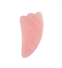 Pink stone with a unique shape on a white background