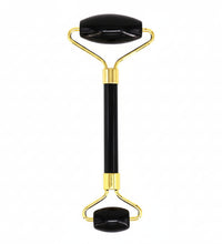Glowing roller with black handle and gold accents on a white background