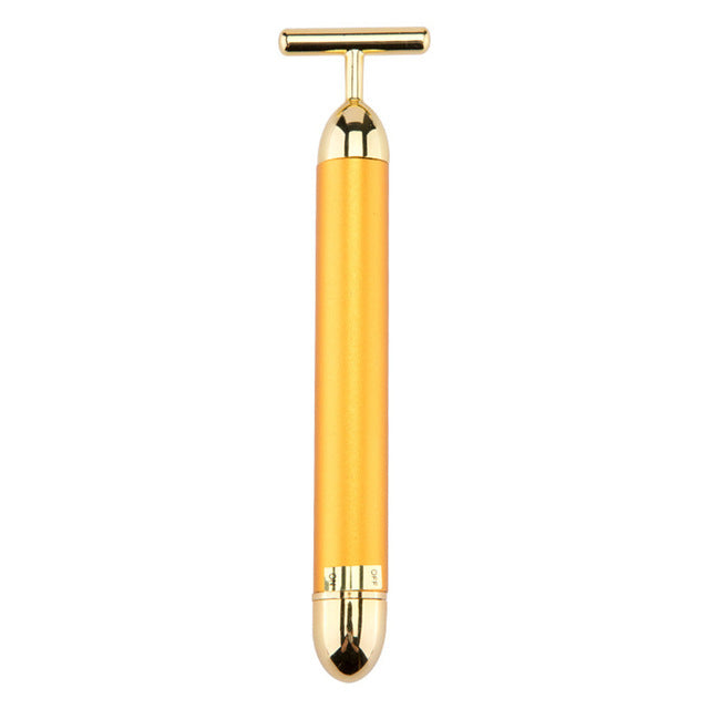 Gold-toned handheld tool on a white background