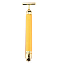 Gold-toned handheld tool on a white background