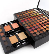 Makeup palette with various shades and brushes on a white background