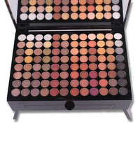 Makeup palette with various shades of eyeshadows on a white background