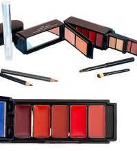 Makeup palettes with lipsticks and brushes on a blue surface
