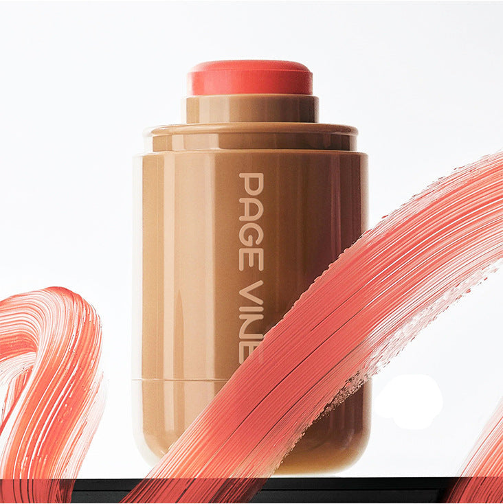 Makeup stick with coral color swatch on a white background, featuring the brand 'PAGE VINE'.