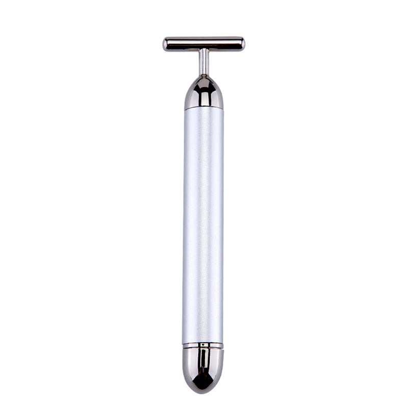 White handheld device with a metallic top on a white background