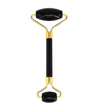 Glowing roller with black handle and gold accents on a white background