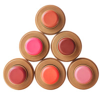 Set of lip glosses in various shades with brown containers on a white background.