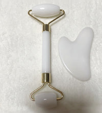 White double roller and scraping board on a textured white background