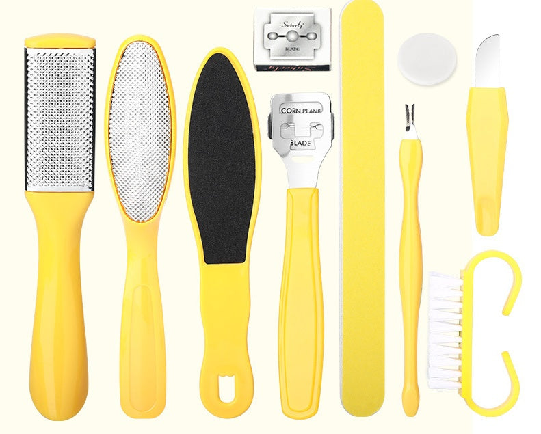 Set of yellow foot care tools including a file, scrubber, and other items on a white background.