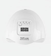 White nail lamp with digital display and American plug on a white background