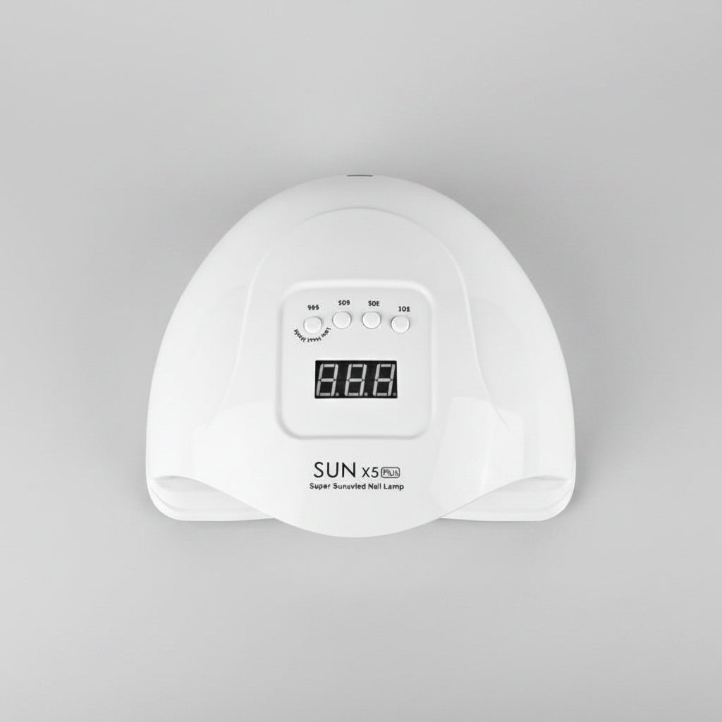 White nail lamp with digital display and Australian plug adapter on a white background