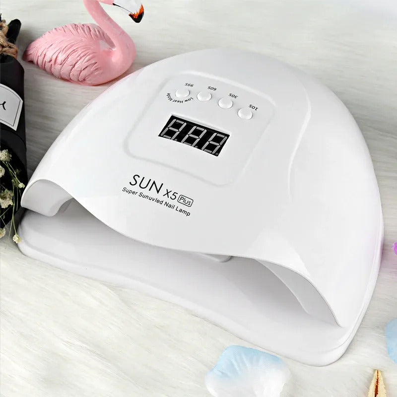 White nail lamp with digital display on a light background