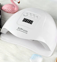 White nail lamp with digital display on a light background