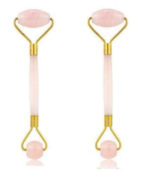 Two pink roller tools with gold accents on a white background