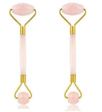 Two pink roller tools with gold accents on a white background
