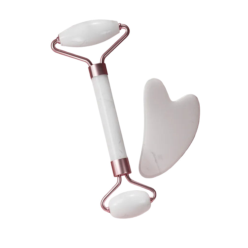 Contoured quartz gua sha plate for gentle facial muscle relaxation.