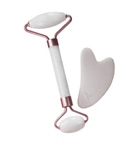 Contoured quartz gua sha plate for gentle facial muscle relaxation.