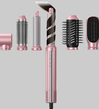 Set of 6 styling heads including curlers, brushes, and dryer nozzle.