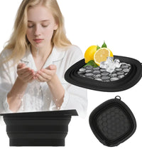 Woman using a folding ice basin with lemon and ice cubes on a white background
