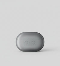 Gray electronic device on a white surface with text about shock absorption and noise reduction.