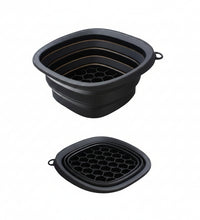 Collapsible black silicone trivet with measurements and folding illustration on a white background