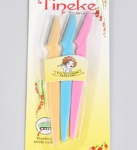 Packaged toothbrushes with colorful handles and 'Tineke' branding on a light blue background.
