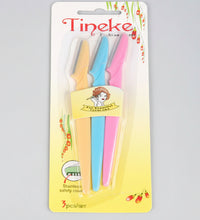 Packaged product with colorful items and 'Tineke' branding on a light blue background