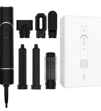 Black hair styling tool with attachments and packaging on a white background