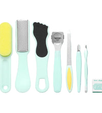 Set of foot care tools on a teal background