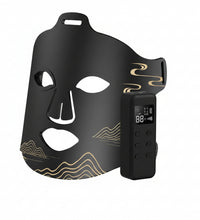 Black face mask with digital display on a white background