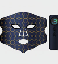 Facial mask with honeycomb pattern and remote control on a white background