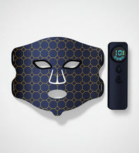 Facial mask with honeycomb pattern and remote control on a white background