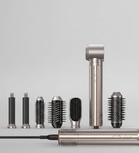 Woman using a hair styling tool with multiple attachments and text indicating 6-in-1 functionality.
