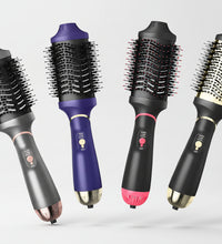 Set of four hair styling tools with different color handles on a geometric background