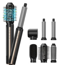 Hair styling tool with multiple attachments on a white background