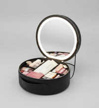 Interior view of the makeup bag showing organized cosmetics and adjustable partitions