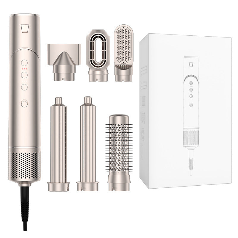 Hair styling tool with multiple attachments and packaging on a white background