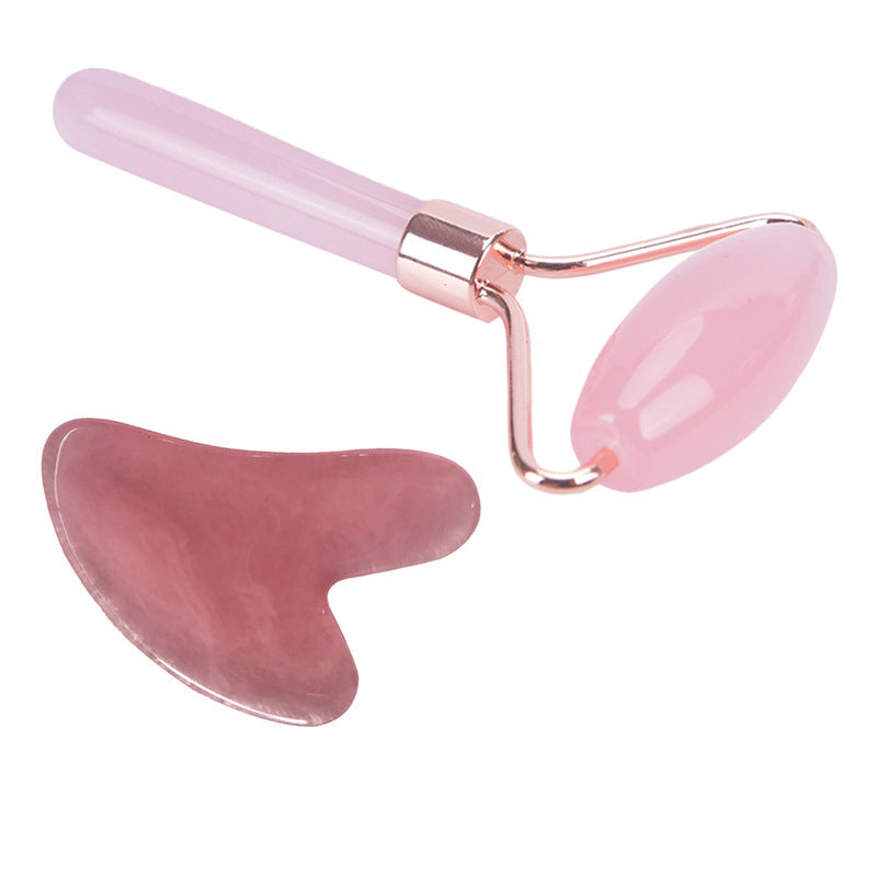 Pink single thrust roller and scraping board on a white background