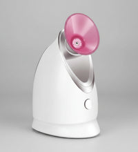 White and pink device with aromatherapy card slot on a pink floral background