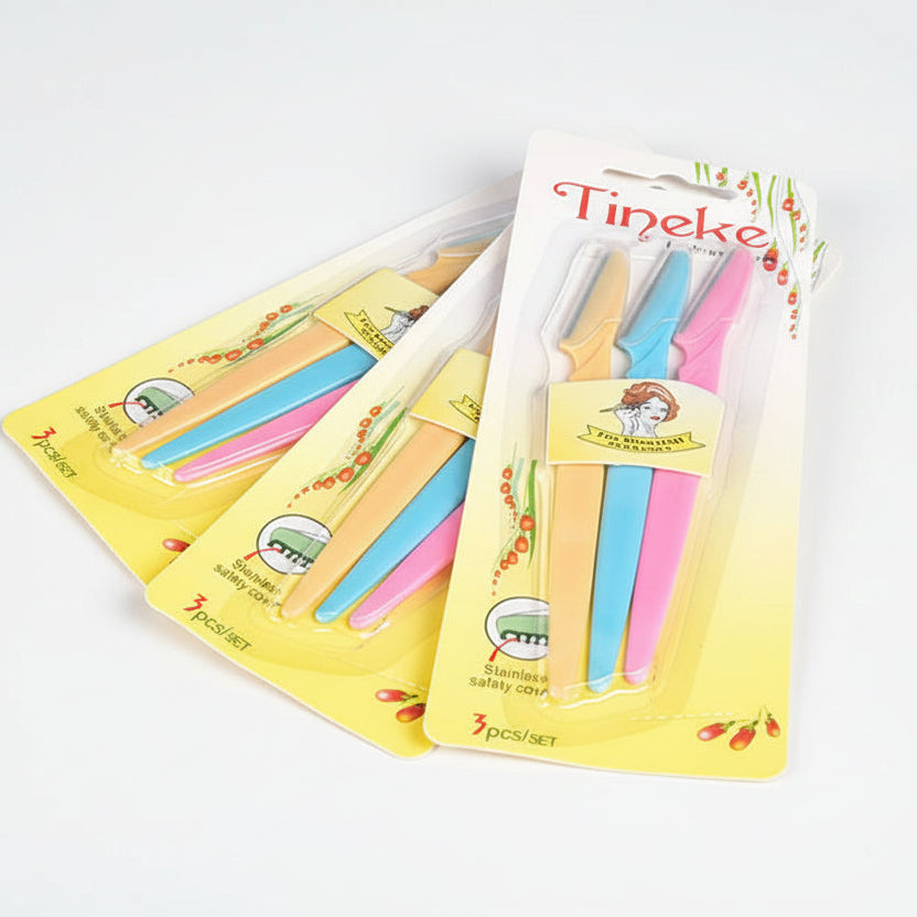 Set of colorful cutlery sets with 'Tineke' packaging on a light blue background.