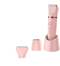 A premium pink 3-in-1 women's multi-function grooming trimmer standing in its charging base.