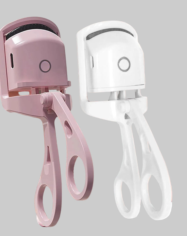 Electric eyelash curler in pink and white on a pink background