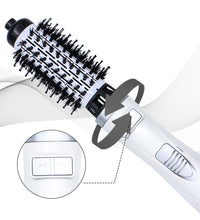 Hot air brush featuring a rotating barrel with soft bristles for effortless hair styling.